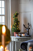 Christmas tree and reindeer statue in panelled 1890s Victorian villa Liverpool