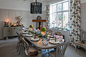 Lit candles on dining table at Christmas in 1890s Victorian villa Liverpool