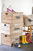 Boots and crates with boy's names in Gloucestershire barn conversion UK