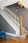 Grey interior staircase with oak banister in Surrey home UK
