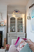 Upcycled dresser with assorted cups and saucers in Norwich home Norfolk UK