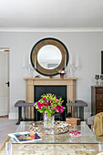 Large mirror and glass coffee table and candlesticks in former Victorian coach house West Sussex UK