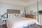 Cool blue walls and pastel pinks in bedroom of Grade II listed country house Hertfordshire UK