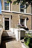 Sunlit exterior of London townhouse UK