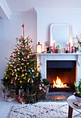 Festive Christmas Fireplace with decorated tree and candles