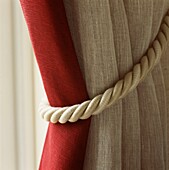 Window treatment curtain and tieback in neutral and red colours