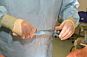 Surgeon holding a skin graft knife