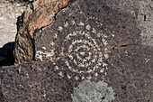 Petroglyph on a basalt boulder, New Mexico, USA
