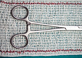 Surgical scissors on a bandage