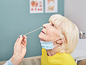 Doctor taking nasal swab