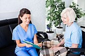 Nurse caring for senior woman