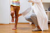 Physical therapist doing medical exam with a boy