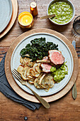One-pot roast rack of lamb with braised cavolo nero and parsley caper dressing