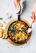 Shakshuka with chickpeas, spinach, and egg
