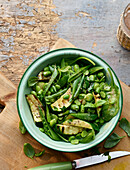 Summer vegetables with broad beans, spinach and zucchini