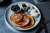 Pancakes with maple syrup and blueberries