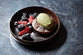 Chocolate torte with berries and a pistachio ice cream