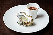 An oyster with mignonette