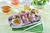 Rice paper rolls filled with duck salad