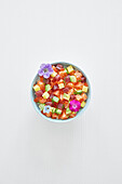Japanese seafood bowl with edible flowers