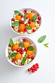 Bulgur with melon balls, cottage cheese, currants and mint