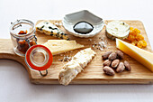 Cheese platter with almonds, balsamic vinegar, sultanas and chutney