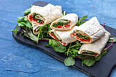Wraps with grilled vegetables, mayonnaise and salad