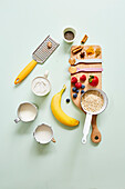Children's porridge ingredients, oats, banana, strawberries, blackberries and spices