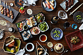 Japanese lunch dishes spread out on the table (filling the frame)