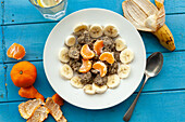 Granola with bananas and clementines