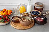 Ingredients for a healthy breakfast with granola and fruit
