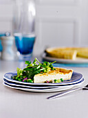 Swedish cheese pie with pea and rocket salad