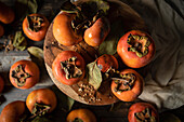Fresh Persimmons in a rustic kitchen