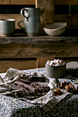 Ingredients for make hot chocolate winter drink: Chopped dark chocolate, species, cane sugar, marshmallows