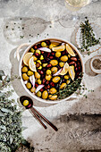 Roasted olives and lemons with herbs