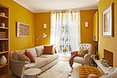 Classic living room with color scheme in cream and ochre