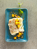 Poached cod with mango and chili