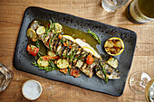 Whole fish with roasted vegetables and samphire