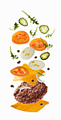 Burger with flying ingredients on white background