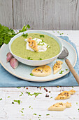 Chervil soup with cream and caraway biscuits