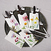 DIY paper cutlery bags with a floral motif