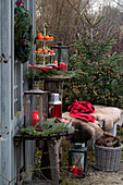 Christmas arrangement with lantern, etagere and bench with animal fur