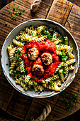 Meatballs in red wine sugo with spiral noodles
