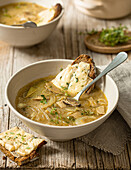 Onion soup with Camembert bread au gratin