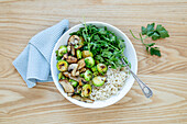 Mushroom and Brussels sprouts with rice in a bowl