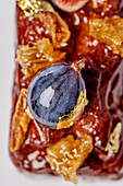 Cake with honey, fig and gold leaf (Close Up)