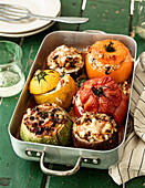 Vegetables stuffed with rice in a baking pan