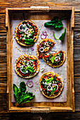 Mini spinach feta pizzas with peppers and salad