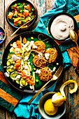 Pistachio falafel with grilled vegetables and sesame yogurt