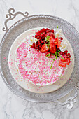 White summer cake with red berries